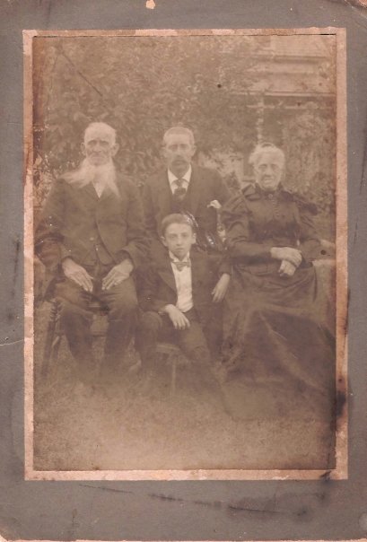 A restored sepia-toned family portrait from the early 1900s
